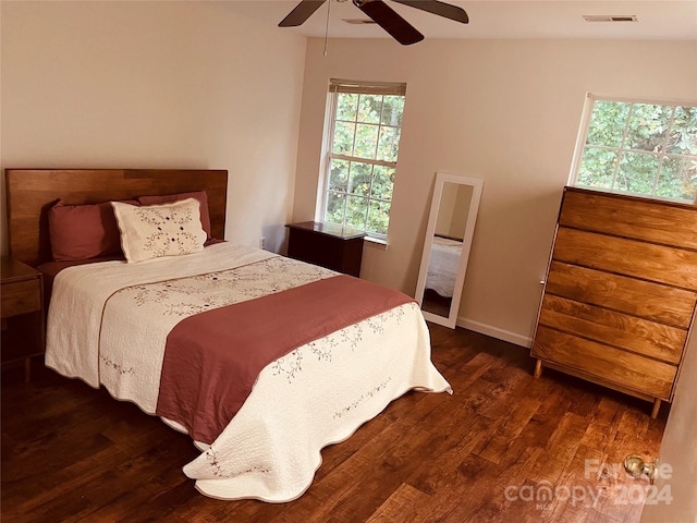 bedroom featuring ceiling fan and dark wood-type flooring