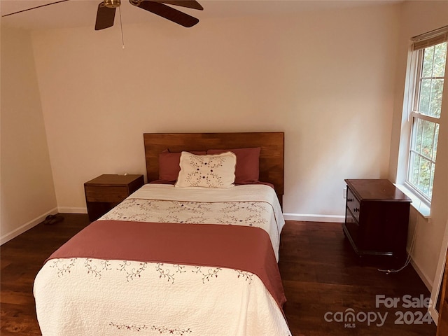 bedroom featuring ceiling fan and dark hardwood / wood-style flooring