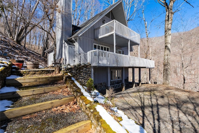 rear view of house featuring a balcony