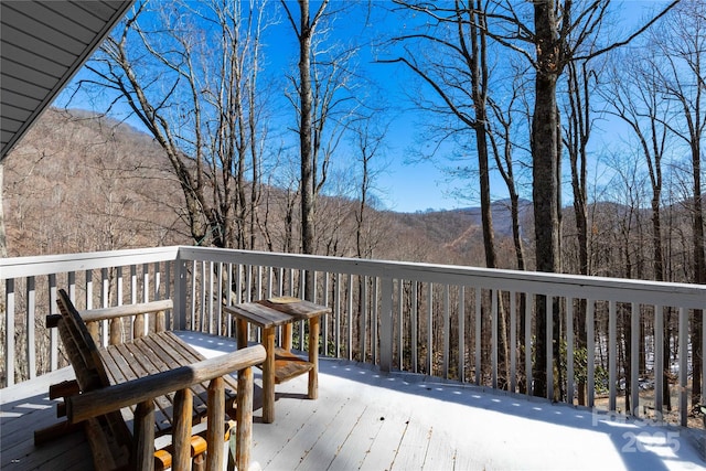 deck featuring a wooded view