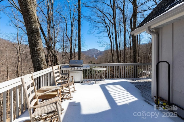 wooden deck featuring a mountain view