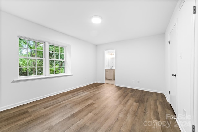 empty room featuring hardwood / wood-style flooring