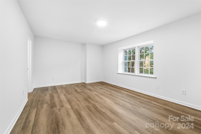 spare room with light hardwood / wood-style floors