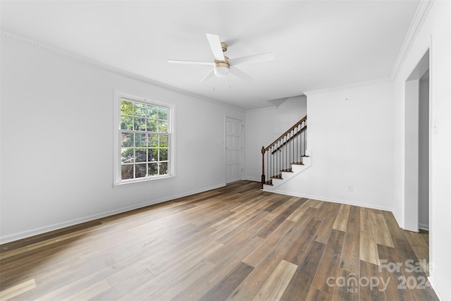 spare room with ceiling fan, hardwood / wood-style flooring, and crown molding