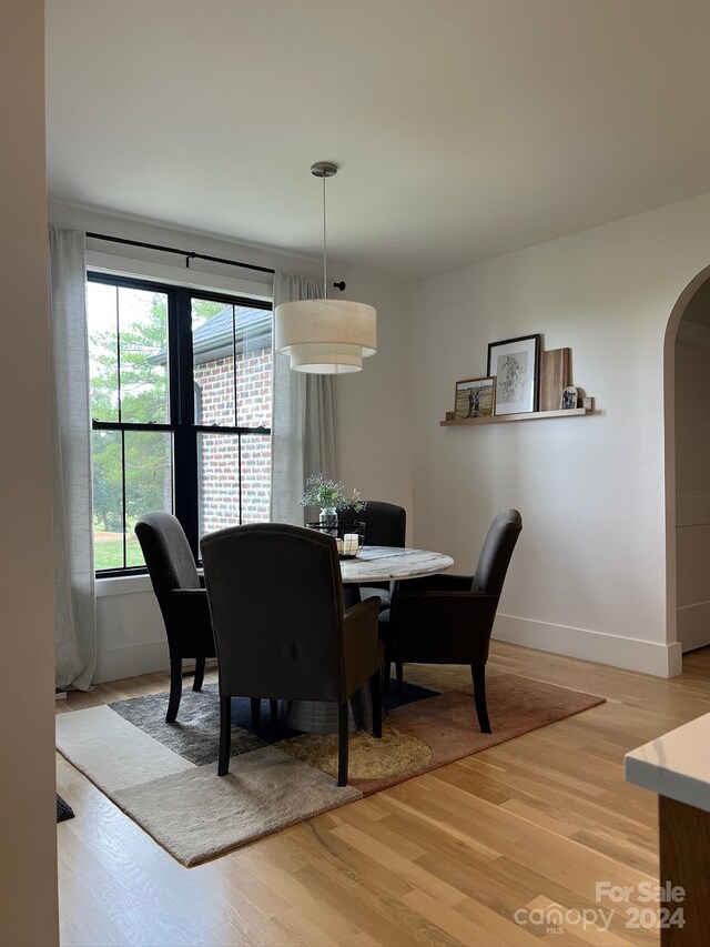 dining space featuring light wood-type flooring