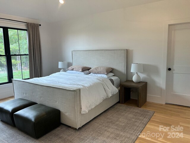 bedroom with light hardwood / wood-style floors