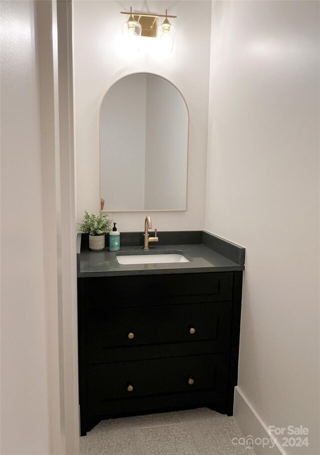 bathroom featuring tile patterned floors and vanity