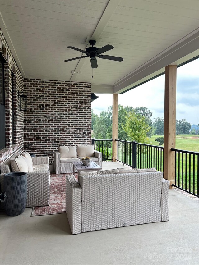 view of patio featuring an outdoor hangout area and ceiling fan