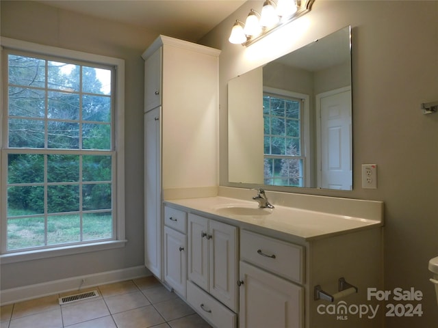 bathroom featuring tile patterned floors and vanity