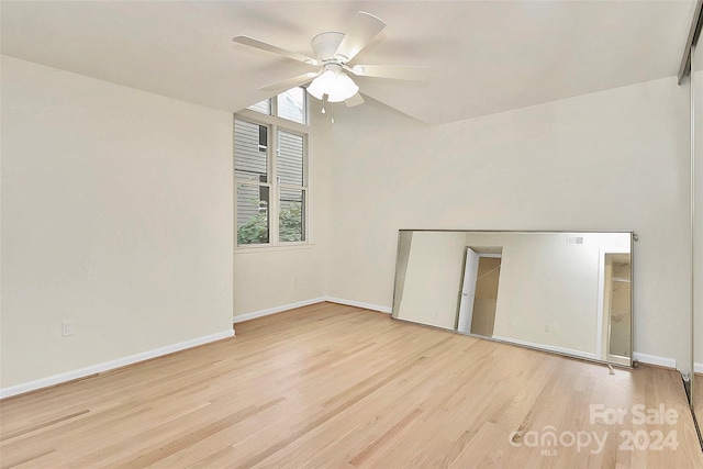 unfurnished room with ceiling fan and light hardwood / wood-style flooring