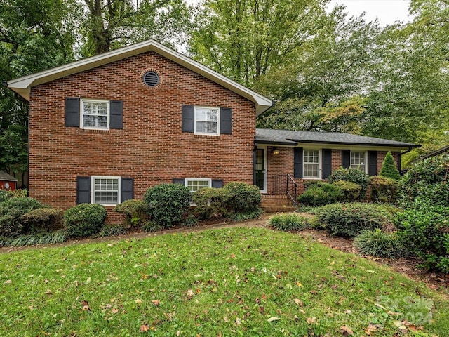 split level home with a front yard