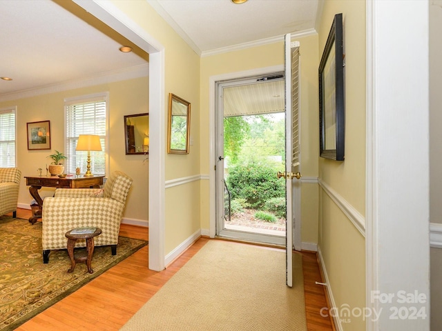 doorway with crown molding and wood-type flooring