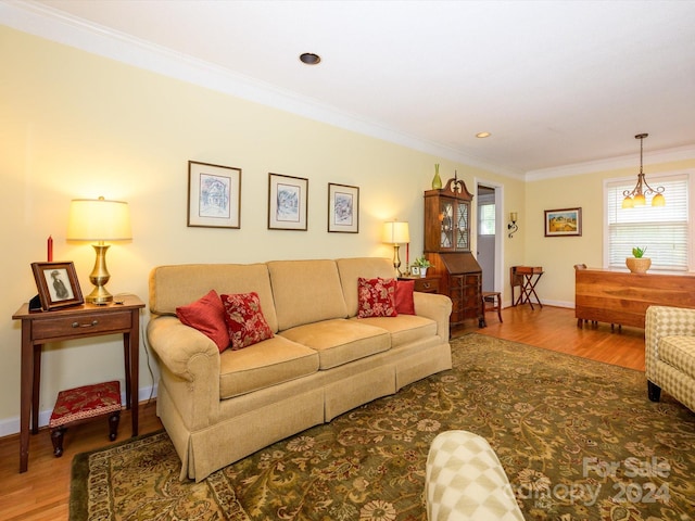 living room with hardwood / wood-style floors and ornamental molding