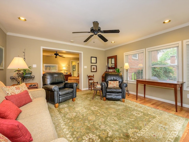 living room featuring hardwood / wood-style flooring and ornamental molding