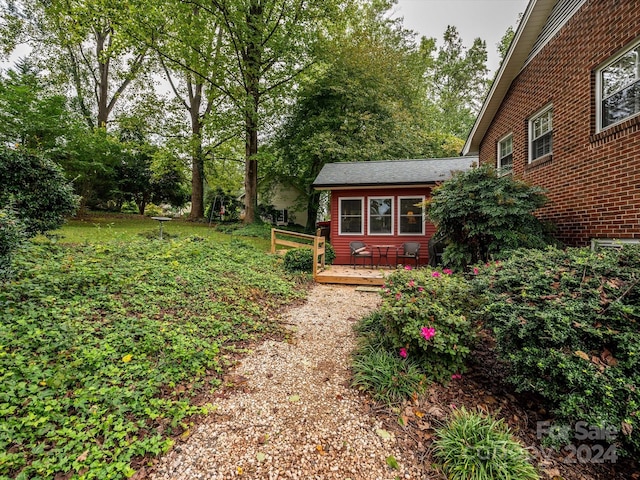 view of yard featuring a wooden deck