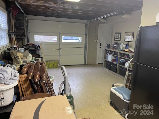 garage with black fridge