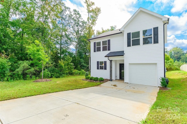 view of front of house featuring a front yard and a garage