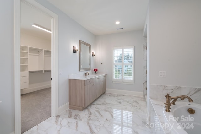 bathroom with a bath and vanity