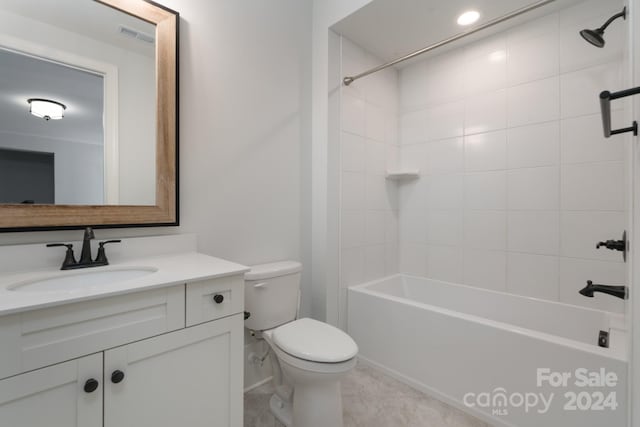 full bathroom with tiled shower / bath, vanity, toilet, and tile patterned floors