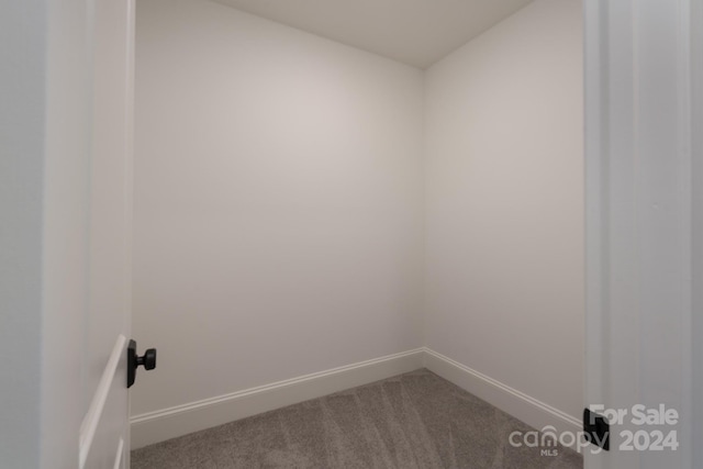 empty room with carpet flooring