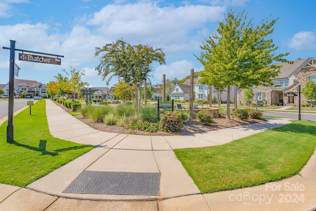 view of community featuring a lawn