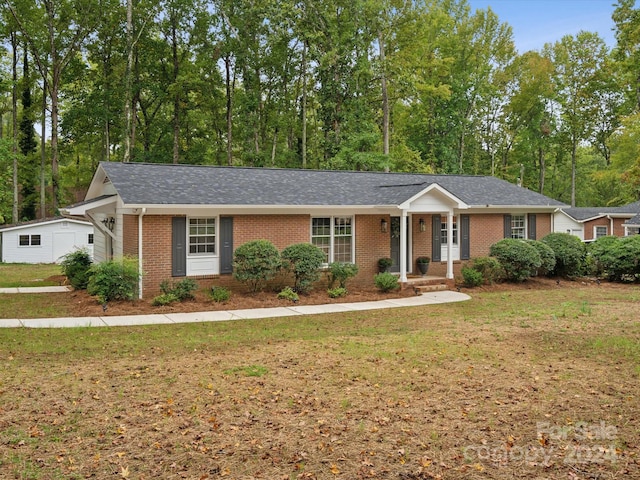 ranch-style house with a front lawn