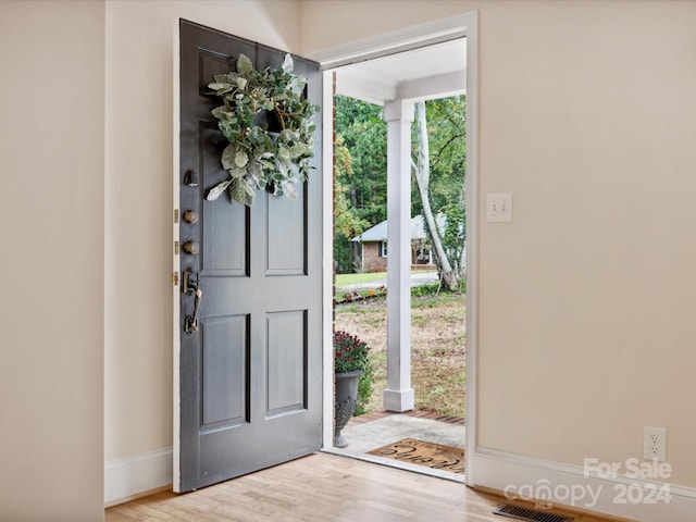 foyer entrance with light hardwood / wood-style floors