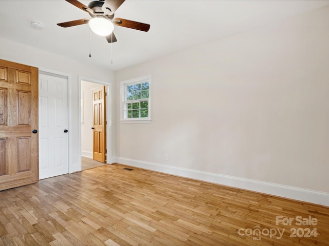 unfurnished bedroom with light wood-type flooring and ceiling fan