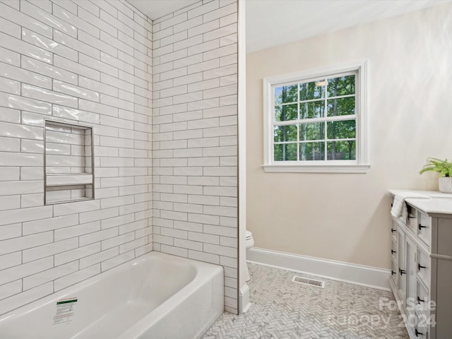 bathroom with tile patterned flooring, vanity, and toilet