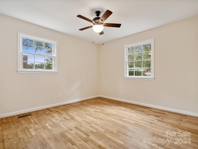 unfurnished room featuring ceiling fan and light hardwood / wood-style flooring