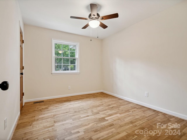 spare room with ceiling fan and light hardwood / wood-style flooring