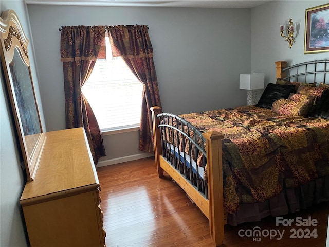 bedroom featuring hardwood / wood-style floors