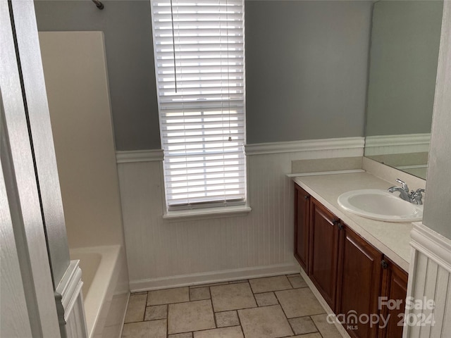 bathroom featuring a bath and vanity