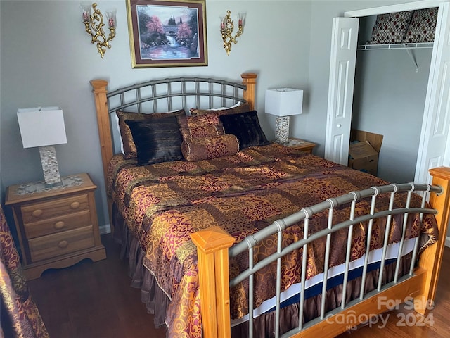 bedroom with hardwood / wood-style flooring and a closet