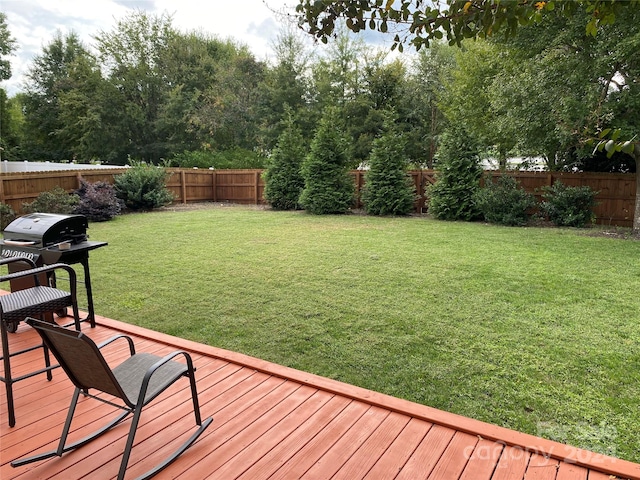 view of yard featuring a wooden deck