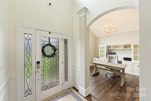 foyer entrance with a chandelier and wood-type flooring