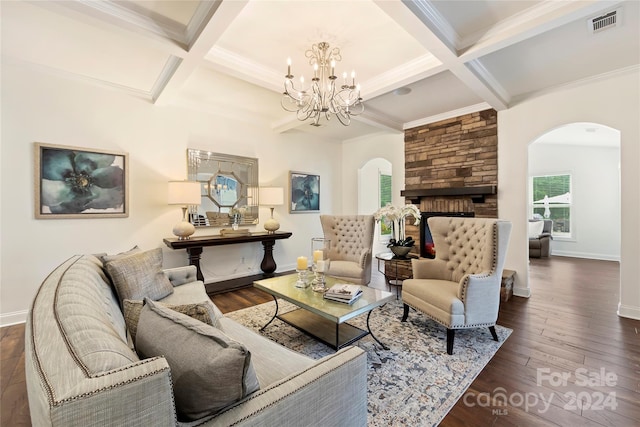 living room featuring beam ceiling, coffered ceiling, dark hardwood / wood-style flooring, and a fireplace