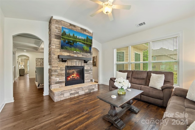 living room with ceiling fan, a fireplace, plenty of natural light, and dark hardwood / wood-style floors