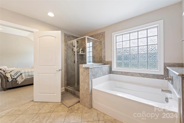 bathroom with plus walk in shower and tile patterned floors