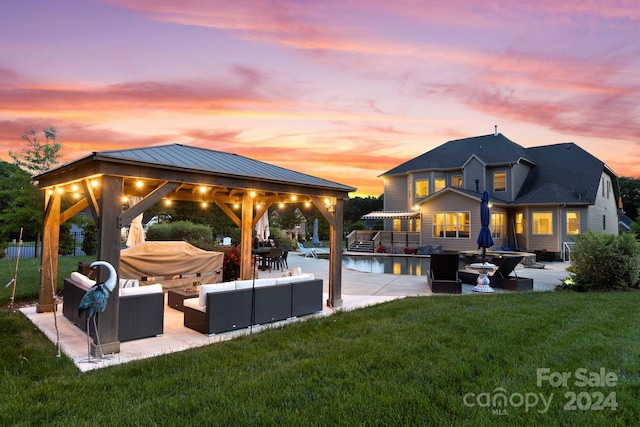 exterior space with a yard, a gazebo, a patio, and an outdoor hangout area