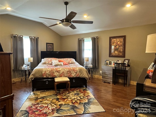 bedroom featuring ceiling fan, dark hardwood / wood-style floors, and vaulted ceiling