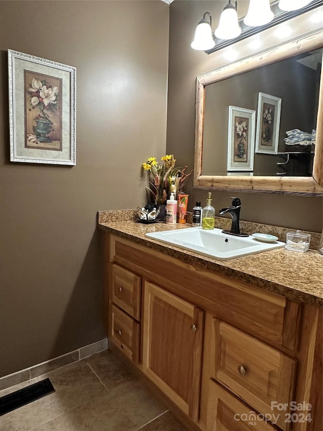 bathroom with tile patterned flooring and vanity