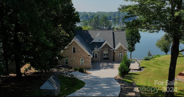 view of front of property with a water view and a front yard