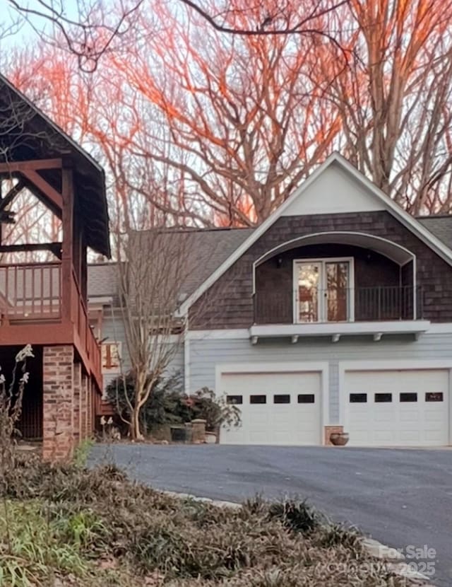 view of side of property featuring a garage