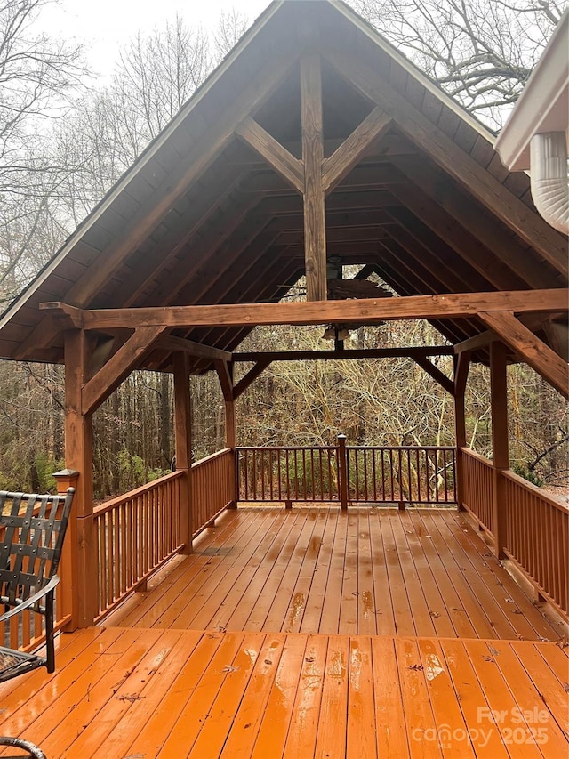 wooden terrace featuring a gazebo