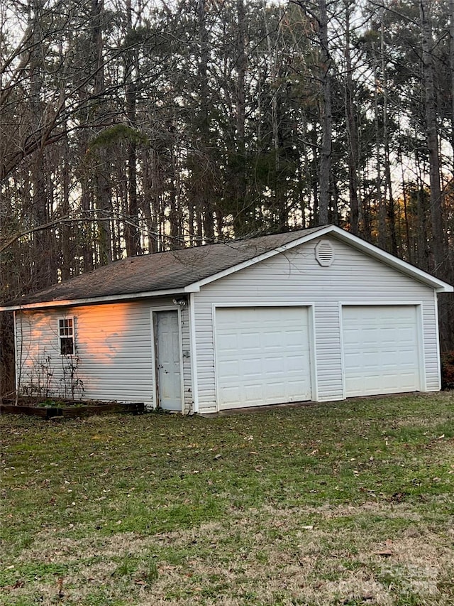 garage with a yard