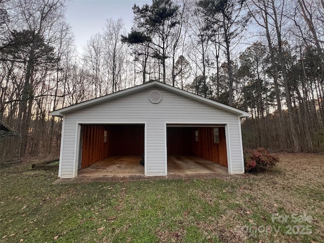 garage featuring a lawn