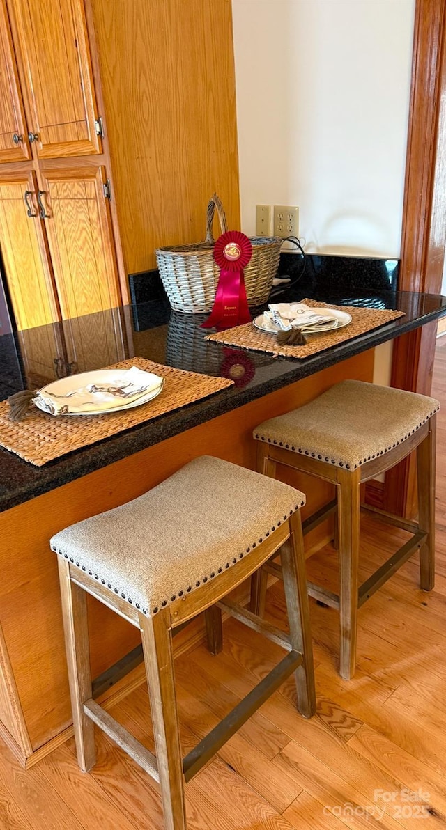 dining space with light hardwood / wood-style flooring