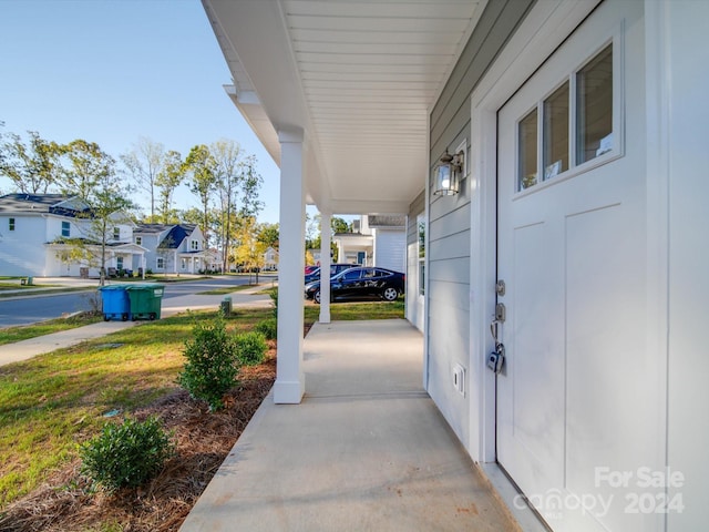 view of patio featuring a porch and a residential view