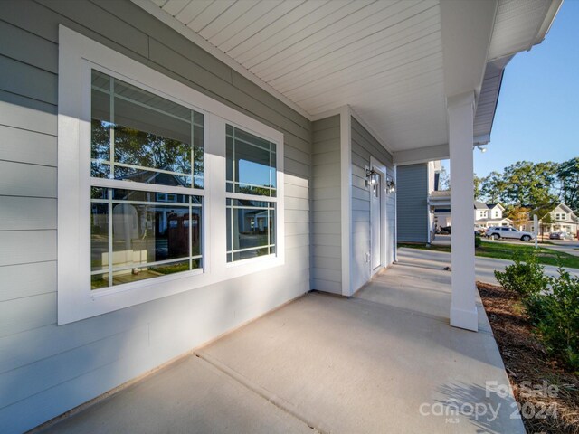 view of patio featuring a porch